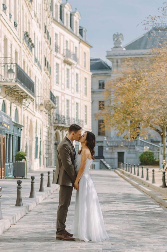 Wide street view of a couple during a lifestyle prewedding photoshoot in Paris